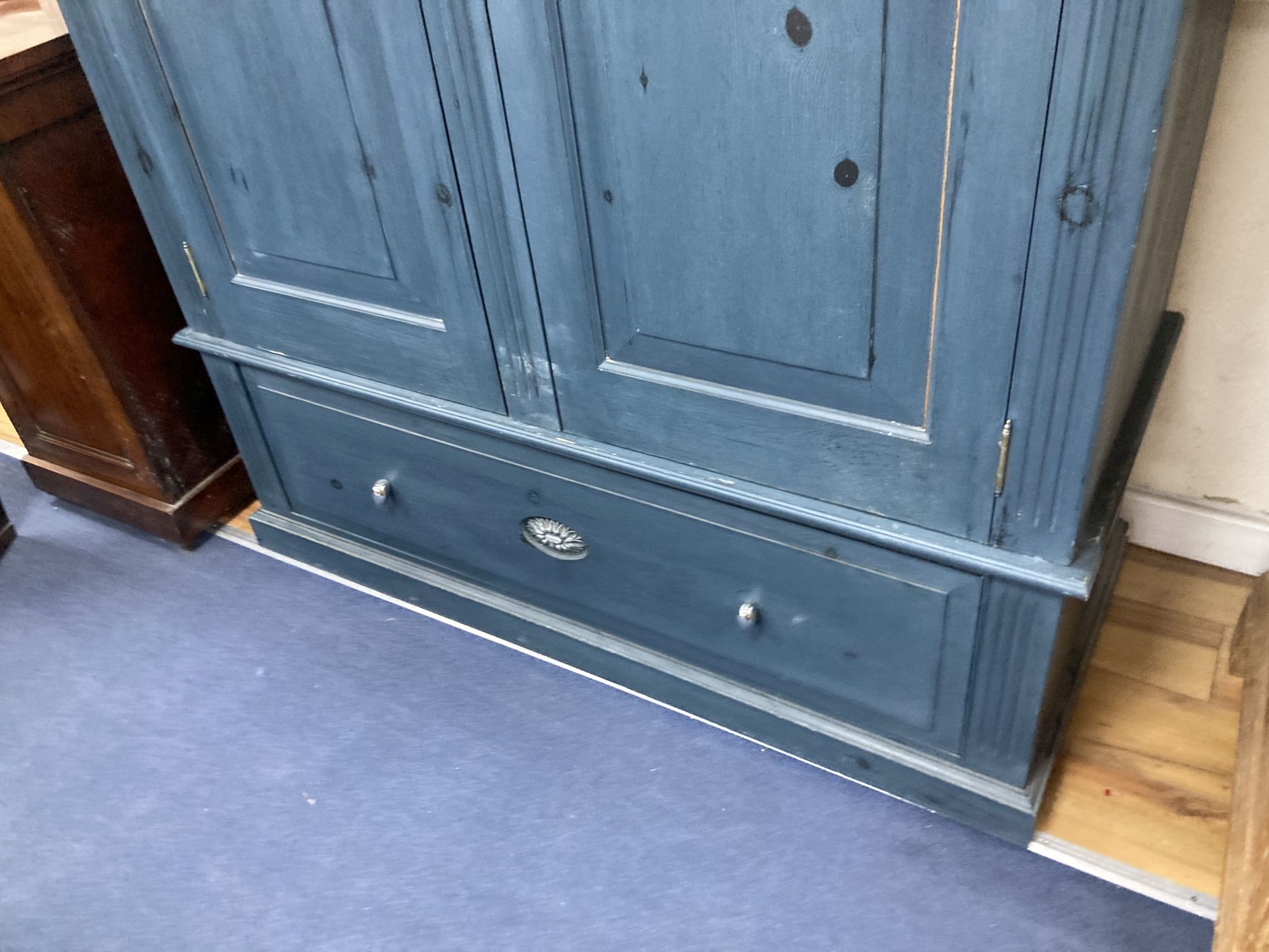 A Victorian style blue painted panelled pine two door wardrobe, width 140cm depth 60cm height 198cm